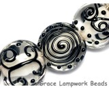 10202302 - Seven Black & White Lentil Beads