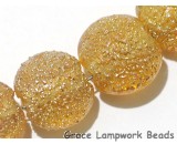 10801202 - Seven Golden Yellow Metallic Lentil Beads