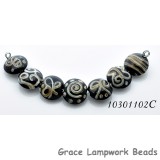 10301102C - Seven Black w/Silver Ivory String Lentil Beads