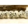 10303001 - Seven Ivory w/Black Rondelle Beads